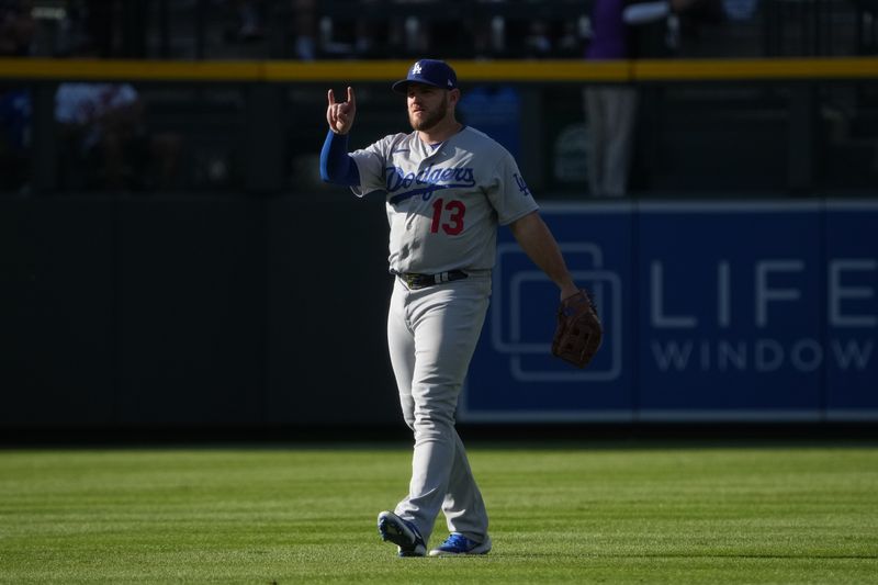 Jul 30, 2022; Denver, Colorado, USA; Los Angeles Dodgers third baseman Max Muncy (13) during the first inning against the Colorado Rockies at Coors Field. Mandatory Credit: Ron Chenoy-USA TODAY Sports