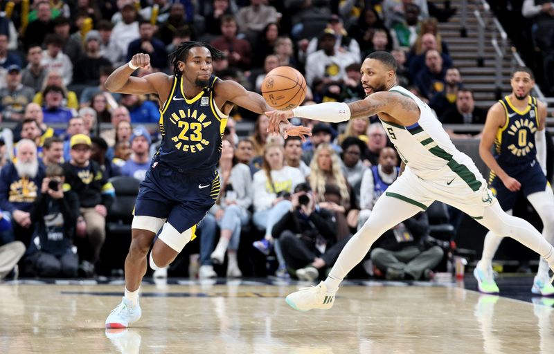 INDIANAPOLIS, INDIANA - JANUARY 03: Aaron Nesmith #23 of the Indiana Pacers and Damian Lillard #0 of the Milwaukee Bucks  reach for a loose ball at Gainbridge Fieldhouse on January 03, 2024 in Indianapolis, Indiana.    NOTE TO USER: User expressly acknowledges and agrees that, by downloading and or using this photograph, User is consenting to the terms and conditions of the Getty Images License Agreement.  (Photo by Andy Lyons/Getty Images)