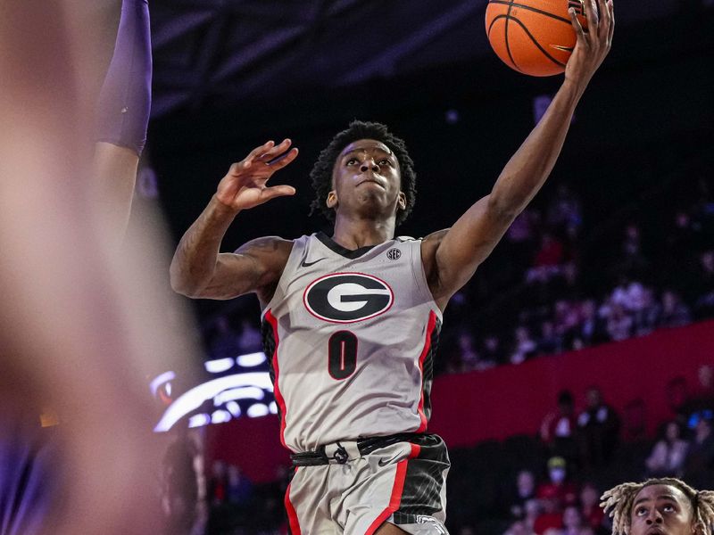 Feb 14, 2023; Athens, Georgia, USA; Georgia Bulldogs guard Terry Roberts (0) takes the ball to the basket against the LSU Tigers during the second half at Stegeman Coliseum. Mandatory Credit: Dale Zanine-USA TODAY Sports