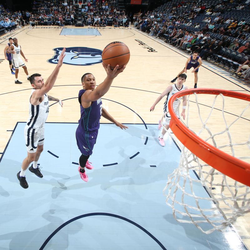 MEMPHIS, TN - MARCH 13: Grant Williams #2 of the Charlotte Hornets drives to the basket during the game against the Memphis Grizzlieson March 13, 2024 at FedExForum in Memphis, Tennessee. NOTE TO USER: User expressly acknowledges and agrees that, by downloading and or using this photograph, User is consenting to the terms and conditions of the Getty Images License Agreement. Mandatory Copyright Notice: Copyright 2024 NBAE (Photo by Joe Murphy/NBAE via Getty Images)