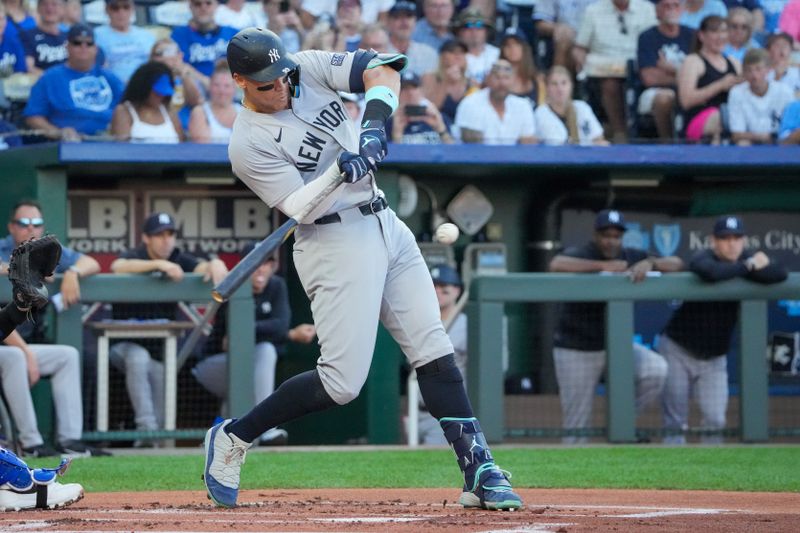 Jun 12, 2024; Kansas City, Missouri, USA; New York Yankees center fielder Aaron Judge (99) hits a single against the Kansas City Royals in the first inning at Kauffman Stadium. Mandatory Credit: Denny Medley-USA TODAY Sports