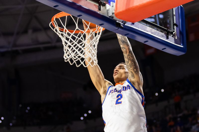 Jan 24, 2024; Gainesville, Florida, USA; Florida Gators guard Riley Kugel (2) dunks the ball against the Mississippi State Bulldogs during the second half at Exactech Arena at the Stephen C. O'Connell Center. Mandatory Credit: Matt Pendleton-USA TODAY Sports