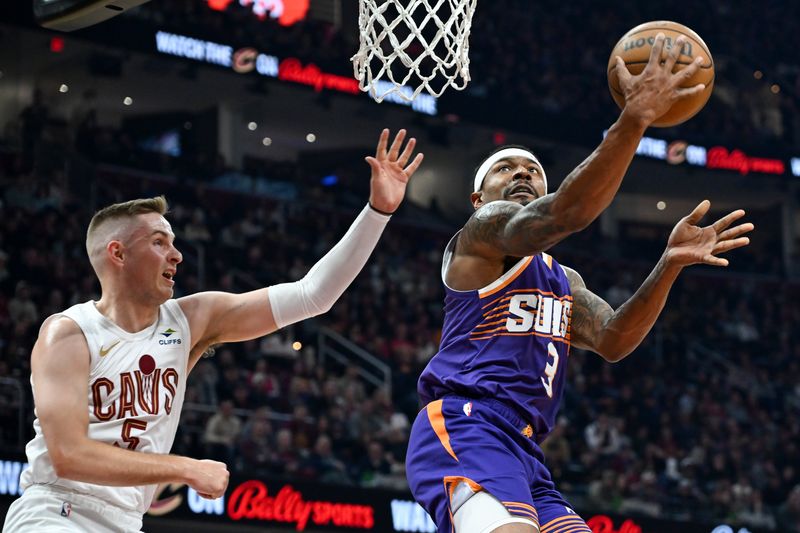 CLEVELAND, OHIO - MARCH 11: Bradley Beal #3 of the Phoenix Suns shoots against Sam Merrill #5 of the Cleveland Cavaliers during the first half at Rocket Mortgage Fieldhouse on March 11, 2024 in Cleveland, Ohio. NOTE TO USER: User expressly acknowledges and agrees that, by downloading and or using this photograph, User is consenting to the terms and conditions of the Getty Images License Agreement. (Photo by Nick Cammett/Getty Images)