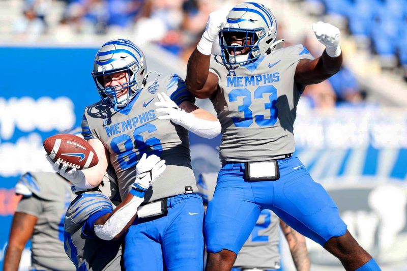 Nov 4, 2023; Memphis, Tennessee, USA;  Memphis Tigers  Brendan Doyle (86) celebrates with teammate Jamauri Chislom (33) after catching a pass for a touchdown against South Florida at Simmons Bank Liberty Stadium. Mandatory Credit: Stu Boyd II-USA TODAY Sports