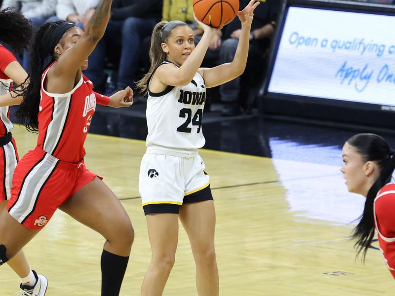 Mar 3, 2024; Iowa City, Iowa, USA; Iowa Hawkeyes guard Gabbie Marshall (24) shoots against the Ohio State Buckeyes during the first half at Carver-Hawkeye Arena. Mandatory Credit: Reese Strickland-USA TODAY Sports