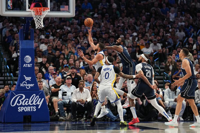 DALLAS, TX - APRIL 5: Stephen Curry #30 of the Golden State Warriors drives to the basket during the game as Kyrie Irving #11 of the Dallas Mavericks plays defense on April 5, 2024 at the American Airlines Center in Dallas, Texas. NOTE TO USER: User expressly acknowledges and agrees that, by downloading and or using this photograph, User is consenting to the terms and conditions of the Getty Images License Agreement. Mandatory Copyright Notice: Copyright 2024 NBAE (Photo by Glenn James/NBAE via Getty Images)