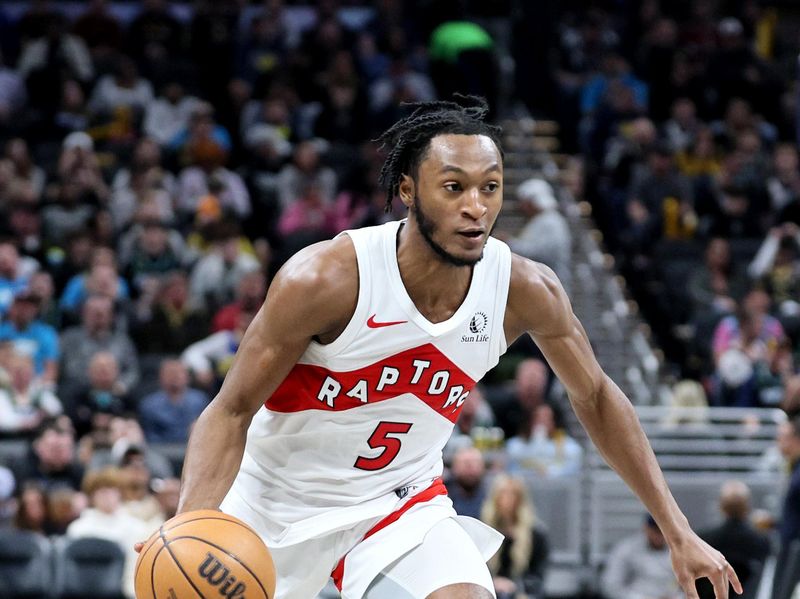 INDIANAPOLIS, INDIANA - FEBRUARY 26:   Immanuel Quickley #5 of the Toronto Raptors dribbles the ball against the Indiana Pacers at Gainbridge Fieldhouse on February 26, 2024 in Indianapolis, Indiana.    NOTE TO USER: User expressly acknowledges and agrees that, by downloading and or using this photograph, User is consenting to the terms and conditions of the Getty Images License Agreement.  (Photo by Andy Lyons/Getty Images)