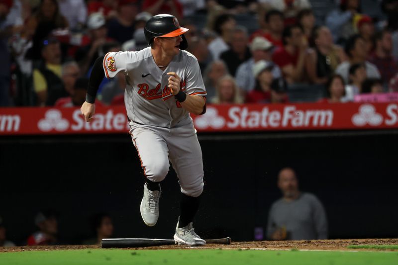 Sep 6, 2023; Anaheim, California, USA;  Baltimore Orioles left fielder Austin Hays (21) hits an RBI single during the third inning against the Los Angeles Angels at Angel Stadium. Mandatory Credit: Kiyoshi Mio-USA TODAY Sports