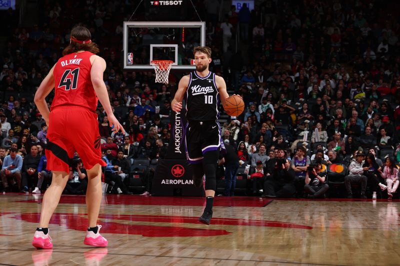 TORONTO, CANADA - MARCH 20: Domantas Sabonis #10 of the Sacramento Kings dribbles the ball during the game against the Toronto Raptors on March 20, 2024 at the Scotiabank Arena in Toronto, Ontario, Canada.  NOTE TO USER: User expressly acknowledges and agrees that, by downloading and or using this Photograph, user is consenting to the terms and conditions of the Getty Images License Agreement.  Mandatory Copyright Notice: Copyright 2024 NBAE (Photo by Vaughn Ridley/NBAE via Getty Images)