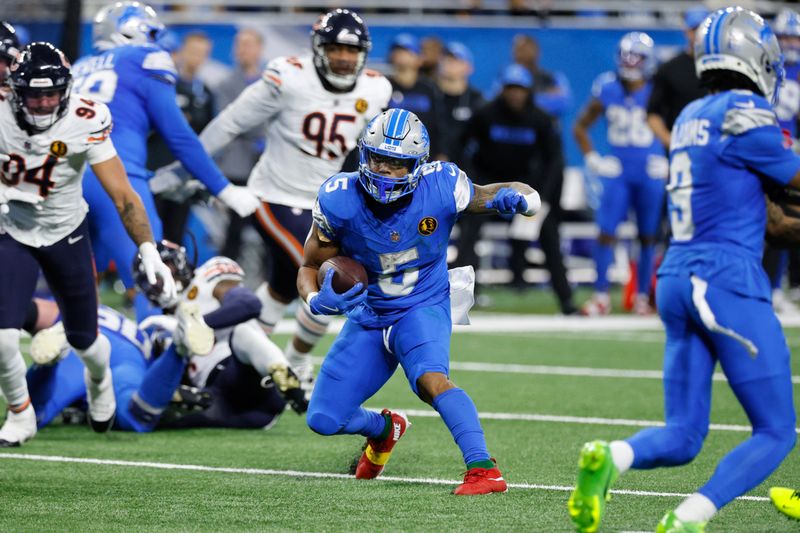 Detroit Lions running back David Montgomery (5) runs the ball against the Chicago Bears during the second half of an NFL football game in Detroit, Thursday, Nov. 28, 2024. (AP Photo/Duane Burleson)