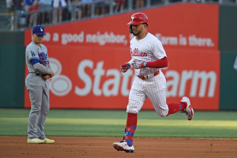 Jul 10, 2024; Philadelphia, Pennsylvania, USA; Philadelphia Phillies designated hitter Kyle Schwarber (12) runs the bases after hitting a home run after hitting a home run during the first inning against the Los Angeles Dodgers at Citizens Bank Park. Mandatory Credit: Eric Hartline-USA TODAY Sports