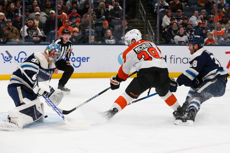 Jan 28, 2026; Columbus, Ohio, USA; Columbus Blue Jackets goalie Elvis Merzlikins (90) makes a save on the shot attempt of Philadelphia Flyers right wing Matvei Michkov (39) during the first period at Nationwide Arena. Mandatory Credit: Russell LaBounty-Imagn Images