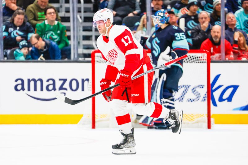 Feb 19, 2024; Seattle, Washington, USA; Detroit Red Wings right wing Daniel Sprong (17) celebrates after scoring a goal against the Seattle Kraken during the second period at Climate Pledge Arena. Mandatory Credit: Joe Nicholson-USA TODAY Sports