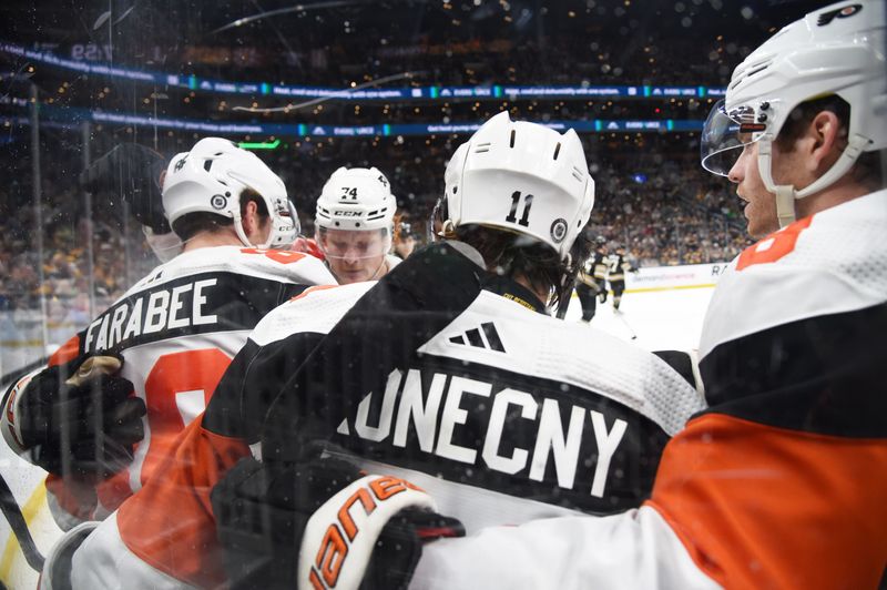 Mar 16, 2024; Boston, Massachusetts, USA; Philadelphia Flyers left wing Joel Farabee (86) is congratulated by his teammates after scoring a goal during the second period against the Boston Bruins at TD Garden. Mandatory Credit: Bob DeChiara-USA TODAY Sports