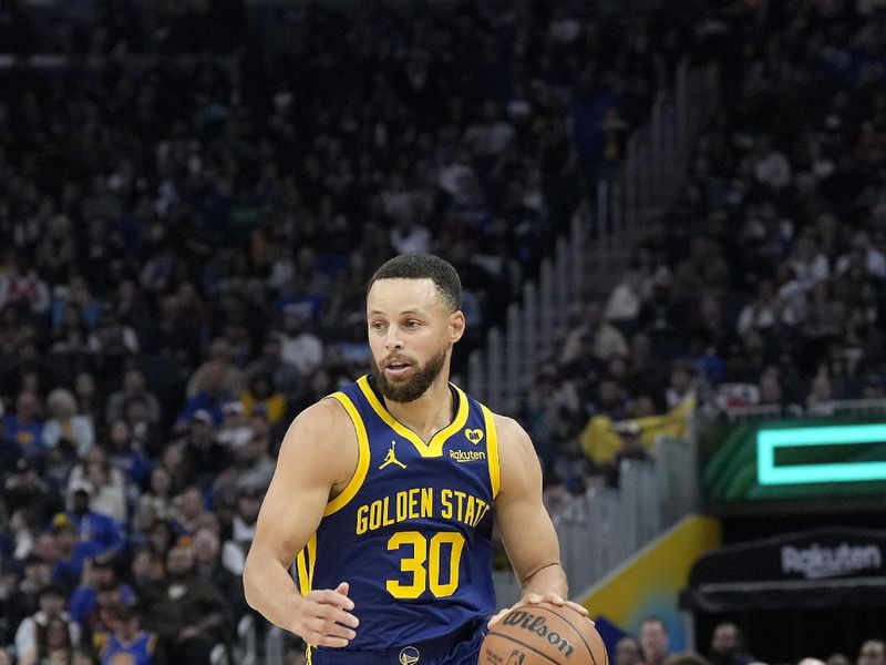 SAN FRANCISCO, CALIFORNIA - FEBRUARY 23: Stephen Curry #30 of the Golden State Warriors dribbles the ball up court against the Charlotte Hornets in the second quarter of an NBA basketball game at Chase Center on February 23, 2024 in San Francisco, California. NOTE TO USER: User expressly acknowledges and agrees that, by downloading and or using this photograph, User is consenting to the terms and conditions of the Getty Images License Agreement. (Photo by Thearon W. Henderson/Getty Images)