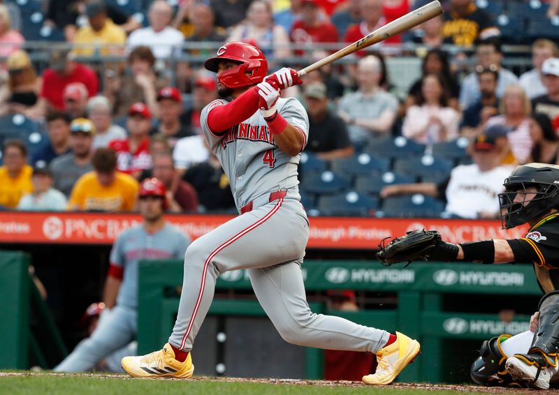 Jun 18, 2024; Pittsburgh, Pennsylvania, USA;  Cincinnati Reds third baseman Santiago Espinal (4) hits a two run home run against the Pittsburgh Pirates during the fifth inning at PNC Park. Mandatory Credit: Charles LeClaire-USA TODAY Sports