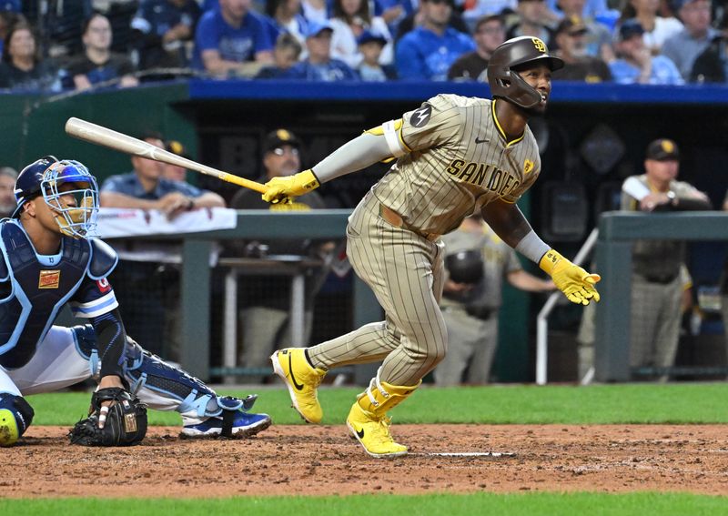 May 31, 2024; Kansas City, Missouri, USA;  San Diego Padres left fielder Jurickson Profar (10) hits an RBI single in the sixth inning against the Kansas City Royals at Kauffman Stadium. Mandatory Credit: Peter Aiken-USA TODAY Sports