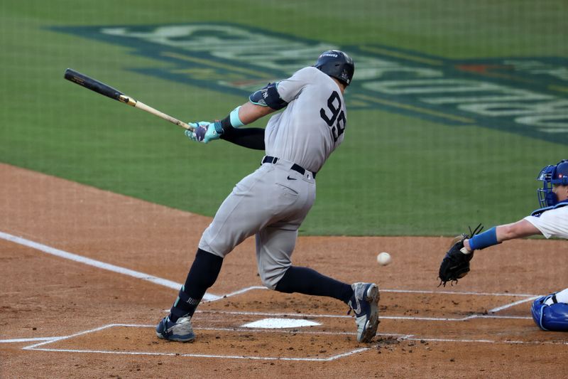 Oct 26, 2024; Los Angeles, California, USA;New York Yankees outfielder Aaron Judge (99) strikes out against the Los Angeles Dodgers in the first inning for game two of the 2024 MLB World Series at Dodger Stadium. Mandatory Credit: Kiyoshi Mio-Imagn Images