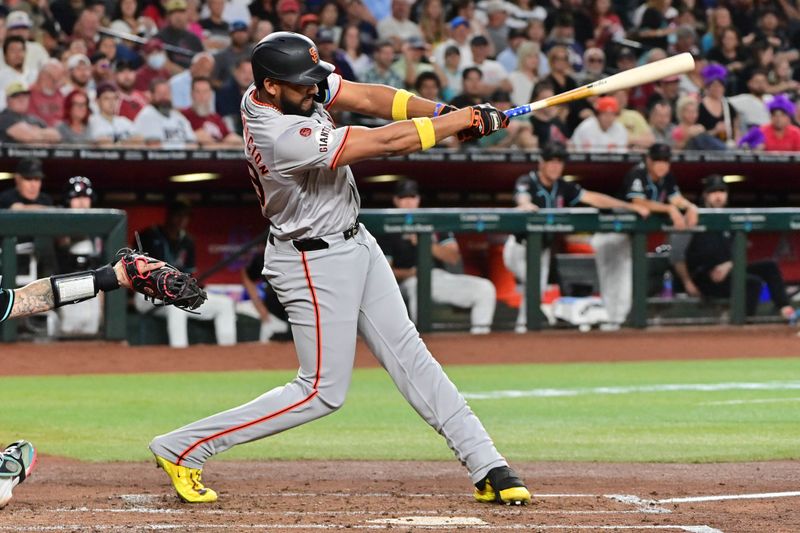 Sep 23, 2024; Phoenix, Arizona, USA;  San Francisco Giants outfielder Jerar Encarnacion (59) hits a RBI double in the third inning against the Arizona Diamondbacks at Chase Field. Mandatory Credit: Matt Kartozian-Imagn Images