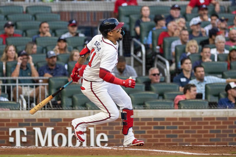 Aug 22, 2024; Cumberland, Georgia, USA; Atlanta Braves shortstop Orlando Arcia (11) reacts after hitting a ball into his ankle against the Philadelphia Phillies during the second inning at Truist Park. Mandatory Credit: Jordan Godfree-USA TODAY Sports