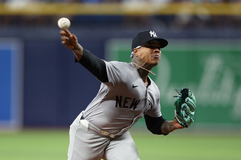 Jul 10, 2024; St. Petersburg, Florida, USA; New York Yankees pitcher Marcus Stroman (0) throws a pitch against the Tampa Bay Rays in the second inning at Tropicana Field. Mandatory Credit: Nathan Ray Seebeck-USA TODAY Sports