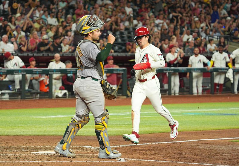 Jun 28, 2024; Phoenix, Arizona, USA; Arizona Diamondbacks outfielder Corbin Carroll (7) scores in the seventh inning against the Oakland Athletics at Chase Field. Mandatory Credit: Allan Henry-USA TODAY Sports