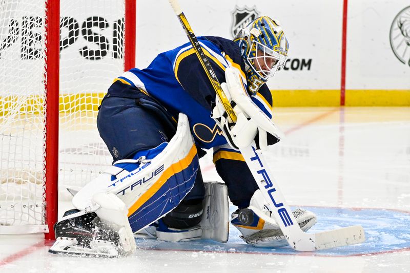 Nov 3, 2023; St. Louis, Missouri, USA;  St. Louis Blues goaltender Jordan Binnington (50) defends the net against the New Jersey Devils during the third period at Enterprise Center. Mandatory Credit: Jeff Curry-USA TODAY Sports