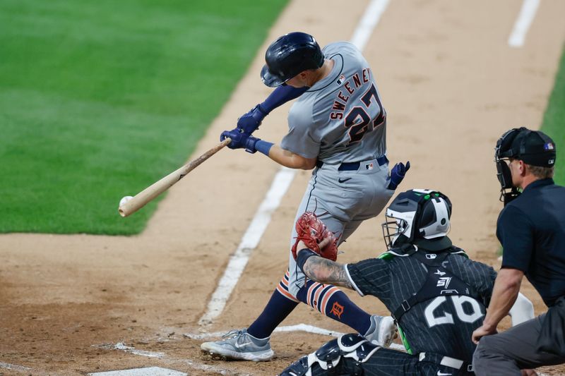 Aug 26, 2024; Chicago, Illinois, USA; Detroit Tigers shortstop Trey Sweeney (27) singles against the Chicago White Sox during the second inning at Guaranteed Rate Field. Mandatory Credit: Kamil Krzaczynski-USA TODAY Sports