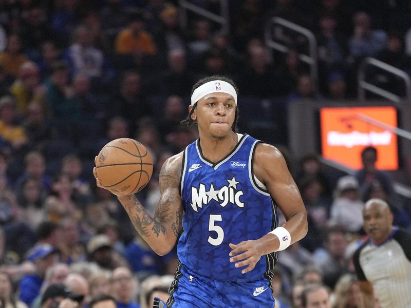 SAN FRANCISCO, CALIFORNIA - JANUARY 02: Paolo Banchero #5 of the Orlando Magic looks to pass the ball against the Golden State Warriors during the first quarter of an NBA basketball game at Chase Center on January 02, 2024 in San Francisco, California. NOTE TO USER: User expressly acknowledges and agrees that, by downloading and or using this photograph, User is consenting to the terms and conditions of the Getty Images License Agreement. (Photo by Thearon W. Henderson/Getty Images)