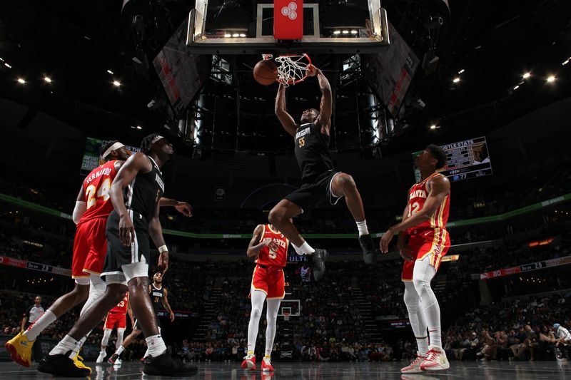 MEMPHIS, TN - MARCH 8: Trey Jemison #55 of the Memphis Grizzlies dunks the ball during the game against the Atlanta Hawks on March 8, 2024 at FedExForum in Memphis, Tennessee. NOTE TO USER: User expressly acknowledges and agrees that, by downloading and or using this photograph, User is consenting to the terms and conditions of the Getty Images License Agreement. Mandatory Copyright Notice: Copyright 2024 NBAE (Photo by Joe Murphy/NBAE via Getty Images)