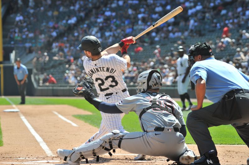 Aug 25, 2024; Chicago, Illinois, USA; Chicago White Sox left fielder Andrew Benintendi (23) hits an RBI ground-rule double during the first inning against the Detroit Tigers at Guaranteed Rate Field. Mandatory Credit: Patrick Gorski-USA TODAY Sports