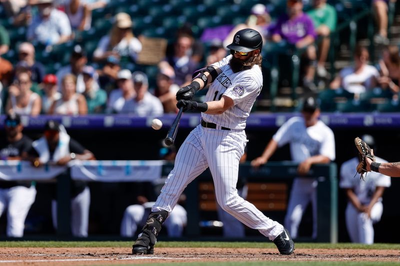 Aug 20, 2023; Denver, Colorado, USA; Colorado Rockies designated hitter Charlie Blackmon (19) hits a triple in the fifth inning against the Chicago White Sox at Coors Field. Mandatory Credit: Isaiah J. Downing-USA TODAY Sports