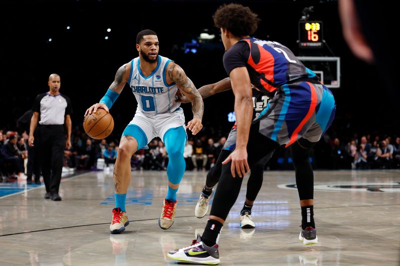 NEW YORK, NEW YORK - NOVEMBER 30: Miles Bridges #0 of the Charlotte Hornets dribbles against Cameron Johnson #2 of the Brooklyn Nets during the first half at Barclays Center on November 30, 2023 in the Brooklyn borough of New York City. NOTE TO USER: User expressly acknowledges and agrees that, by downloading and/or using this Photograph, user is consenting to the terms and conditions of the Getty Images License Agreement. (Photo by Sarah Stier/Getty Images)