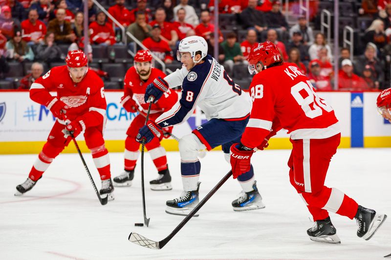 Mar 19, 2024; Detroit, Michigan, USA; Columbus Blue Jackets defenseman Zach Werenski (8) shoots the puck during the first period of the game against the Detroit Red Wings at Little Caesars Arena. Mandatory Credit: Brian Bradshaw Sevald-USA TODAY Sports