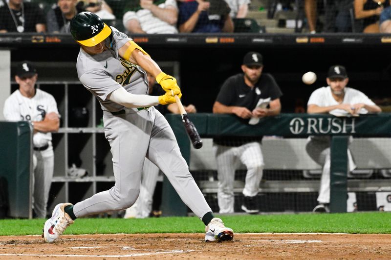 Sep 13, 2024; Chicago, Illinois, USA;  Oakland Athletics second base Zack Gelof (20) hits an RBI double against the Chicago White Sox during the fourth inning at Guaranteed Rate Field. Mandatory Credit: Matt Marton-Imagn Images