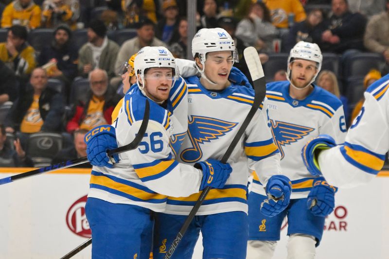 Dec 11, 2025; Nashville, Tennessee, USA;  St. Louis Blues left wing Hugh McGing (56) celebrates his goal with right wing Dalibor Dvorsky (54) against the Nashville Predators during the second period at Bridgestone Arena. Mandatory Credit: Steve Roberts-Imagn Images