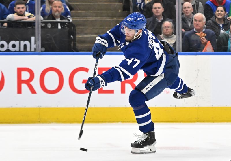 Jan 3, 2023; Toronto, Ontario, CAN; Toronto Maple Leafs forward Pierre Engvall (47) shoots the puck against the St. Louis Blues in the third period at Scotiabank Arena. Mandatory Credit: Dan Hamilton-USA TODAY Sports