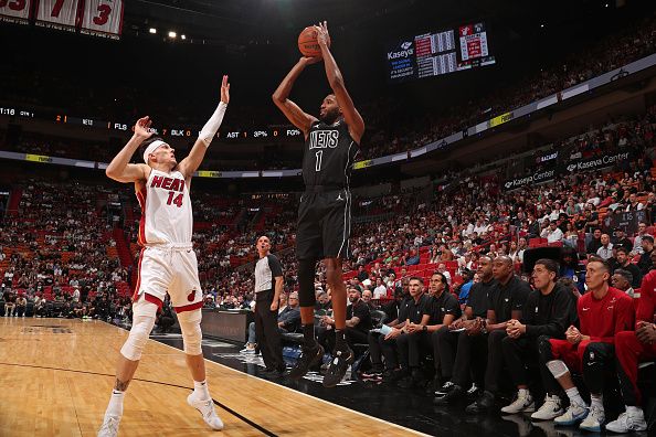 MIAMI, FL - NOVEMBER 1: Mikal Bridges #1 of the Brooklyn Nets three point basket against the Miami Heat on November 1, 2023 at Kaseya Center in Miami, Florida. NOTE TO USER: User expressly acknowledges and agrees that, by downloading and or using this Photograph, user is consenting to the terms and conditions of the Getty Images License Agreement. Mandatory Copyright Notice: Copyright 2023 NBAE (Photo by Issac Baldizon/NBAE via Getty Images)