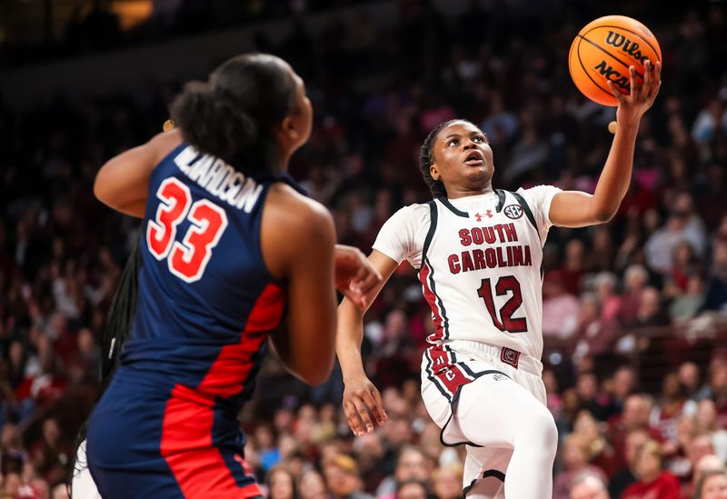 Feb 4, 2024; Columbia, South Carolina, USA; South Carolina Gamecocks guard MiLaysia Fulwiley (12) drives against the Ole Miss Rebels in the second half at Colonial Life Arena. Mandatory Credit: Jeff Blake-USA TODAY Sports