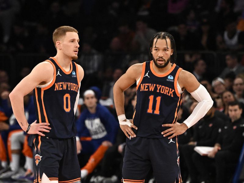 NEW YORK, NY - FEBRUARY 6: Donte Divincenzo #0 and Jalen Brunson #11 of the New York Knicks looks on during the game against the Memphis Grizzlies on February 6, 2024 at Madison Square Garden in New York City, New York.  NOTE TO USER: User expressly acknowledges and agrees that, by downloading and or using this photograph, User is consenting to the terms and conditions of the Getty Images License Agreement. Mandatory Copyright Notice: Copyright 2024 NBAE  (Photo by David Dow/NBAE via Getty Images)