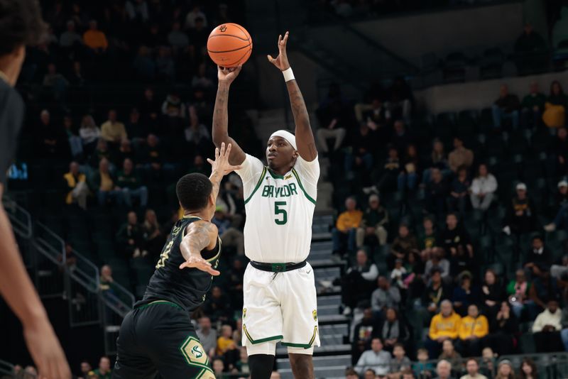 Dec 2, 2025; Waco, Texas, USA;  Baylor Bears guard Obi Agbim (5) scores a three-point basket against Sacramento State Hornets forward Shaqir ONeal (8) during the first half at Paul and Alejandra Foster Pavilion. Mandatory Credit: Chris Jones-Imagn Images