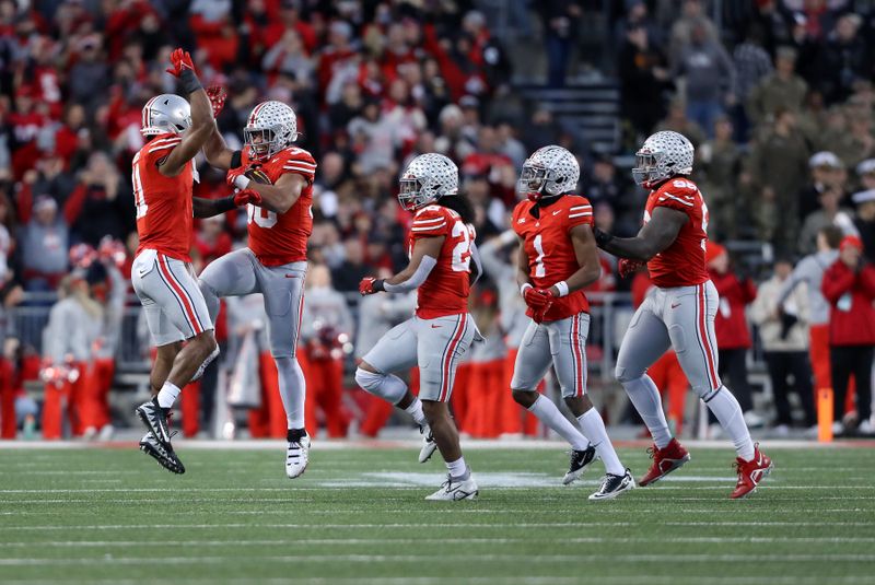 Nov 18, 2023; Columbus, Ohio, USA; Ohio State Buckeyes linebacker Cody Simon (30) celebrates with linebacker C.J. Hicks (11) during the second half against the Minnesota Golden Gophers at Ohio Stadium. Mandatory Credit: Joseph Maiorana-USA TODAY Sports