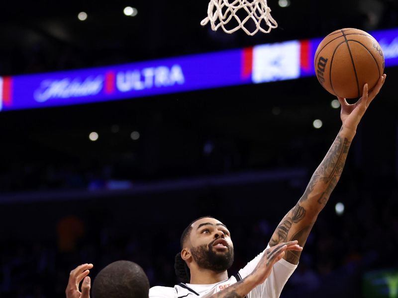 LOS ANGELES, CALIFORNIA - JANUARY 17: D'Angelo Russell #1 of the Brooklyn Nets attempts a layup against Trey Jemison III #55 of the Los Angeles Lakers during the first quarter at Crypto.com Arena on January 17, 2025 in Los Angeles, California. NOTE TO USER: User expressly acknowledges and agrees that, by downloading and/or using this Photograph, user is consenting to the terms and conditions of the Getty Images License Agreement. (Photo by Katelyn Mulcahy/Getty Images)