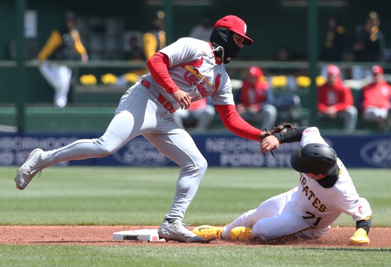 Apr 9, 2025; Pittsburgh, Pennsylvania, USA;  St. Louis Cardinals shortstop Masyn Winn (0) tags Pittsburgh Pirates shortstop Tsung-Che Cheng  (71) out at second base on a steal attempt during the sixth inning at PNC Park. Mandatory Credit: Charles LeClaire-Imagn Images