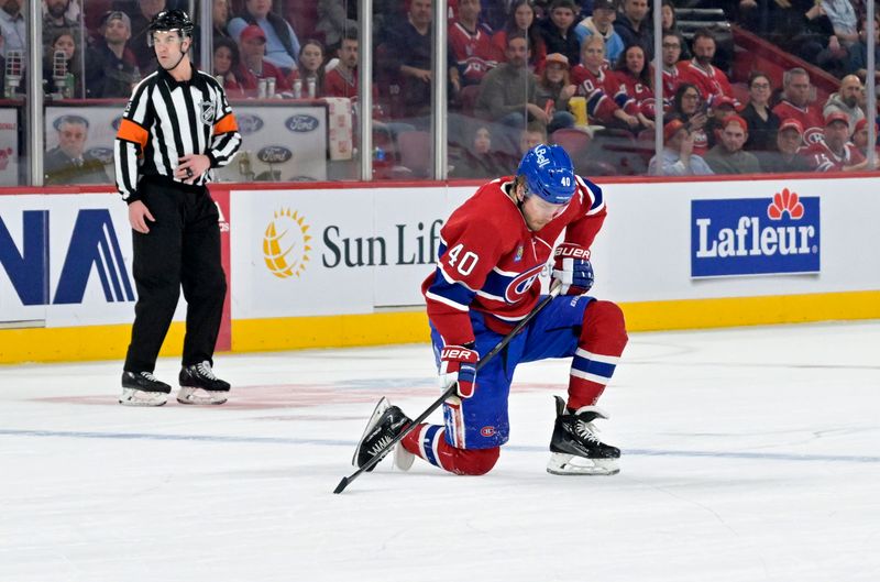 Apr 6, 2024; Montreal, Quebec, CAN; Montreal Canadiens forward Joel Armia (40) puts a knee on the ice during the first period of the game against the Toronto Maple Leafs at the Bell Centre. Mandatory Credit: Eric Bolte-USA TODAY Sports