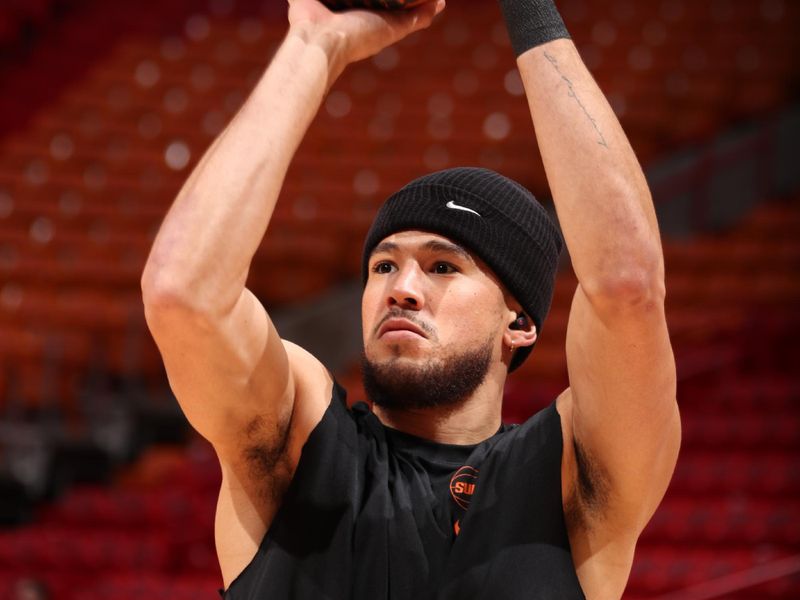 MIAMI, FL - JANUARY 29: Devin Booker #1 of the Phoenix Suns warms up before the game against the Miami Heat on January 29, 2024 at Kaseya Center in Miami, Florida. NOTE TO USER: User expressly acknowledges and agrees that, by downloading and or using this Photograph, user is consenting to the terms and conditions of the Getty Images License Agreement. Mandatory Copyright Notice: Copyright 2024 NBAE (Photo by Issac Baldizon/NBAE via Getty Images)