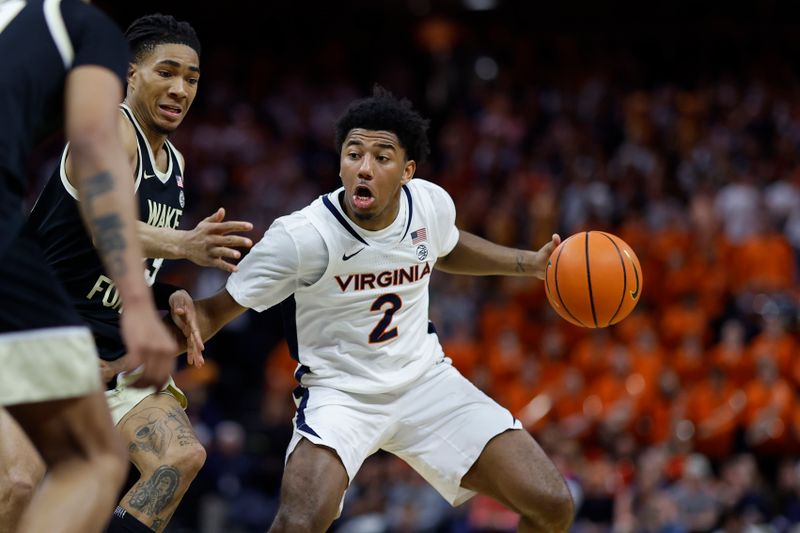 Feb 17, 2024; Charlottesville, Virginia, USA; Virginia Cavaliers guard Reece Beekman (2) drives to the basket as Wake Forest Demon Deacons guard Hunter Sallis (23) defends in the second half at John Paul Jones Arena. Mandatory Credit: Geoff Burke-USA TODAY Sports