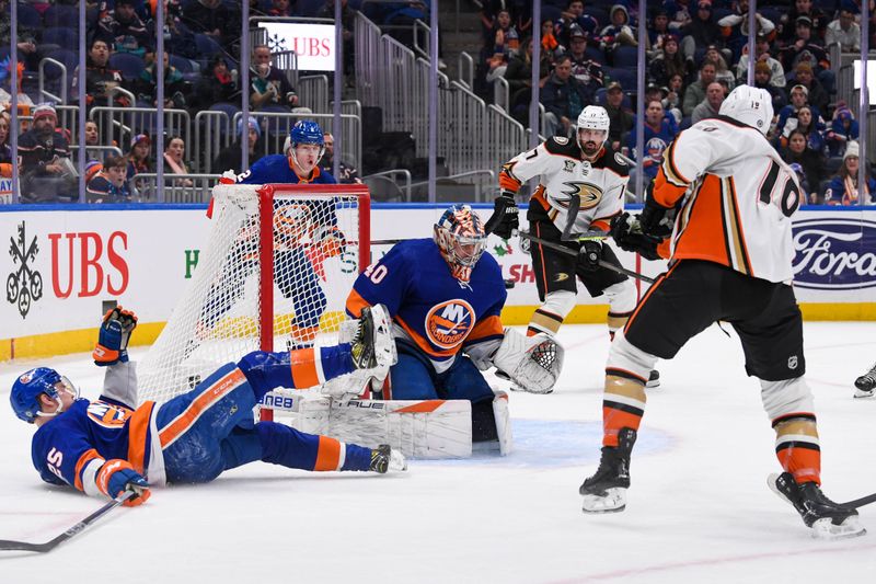 Dec 13, 2023; Elmont, New York, USA; New York Islanders goaltender Semyon Varlamov (40) makes a save on Anaheim Ducks right wing Troy Terry (19) during the third period at UBS Arena. Mandatory Credit: Dennis Schneidler-USA TODAY Sports