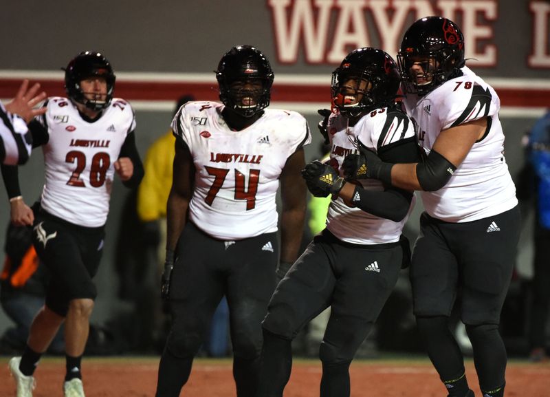 Nov 16, 2019; Raleigh, NC, USA; Louisville Cardinals h-back Marshon Ford (83) celebrates with teammates after scoring a touchdown during the second half against the North Carolina State Wolfpack at Carter-Finley Stadium. Mandatory Credit: Rob Kinnan-USA TODAY Sports