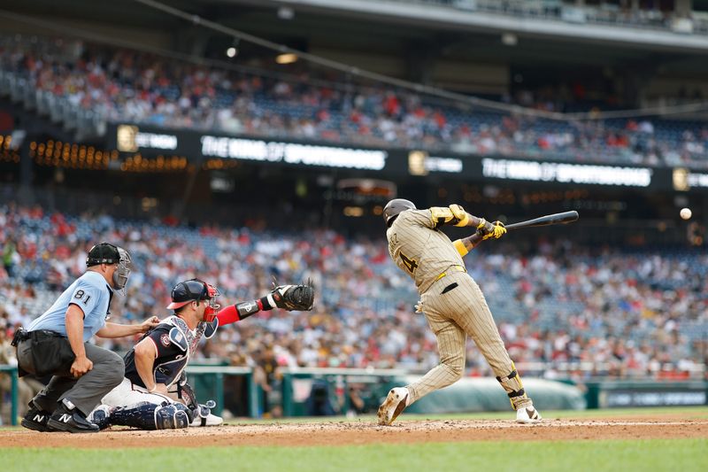 Jul 24, 2024; Washington, District of Columbia, USA; San Diego Padres first baseman Luis Arraez (4) hits a two run home run against the Washington Nationals during the second inning at Nationals Park. Mandatory Credit: Geoff Burke-USA TODAY Sports